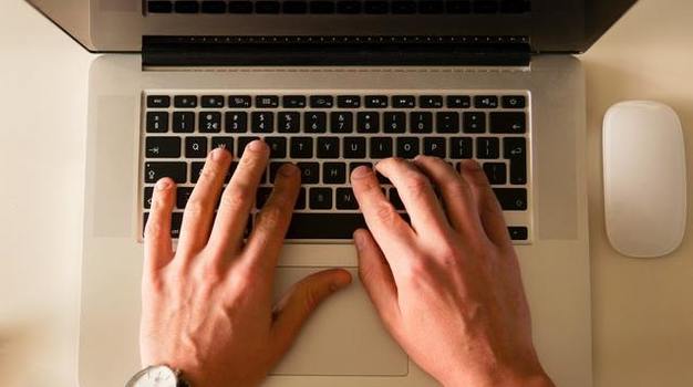 hands on laptop (cropped)